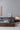 Made to order Earth Frame upholstered platform bed with a walnut finish, showcasing a sleek, modern design and plush headboard.