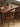 Mesa de comedor americana de madera de nogal oscuro de mediados de siglo.
