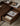 Made to order Floor Form low platform bed frame in walnut finish, showcasing its sleek, minimalist design on a clean floor.