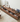 Custom-made PrimePlank Walnut TV console with a sleek, low-profile design and spacious storage for modern living rooms.