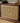 Made-to-order LumberLux Japanese-style walnut TV console with rattan door, showcasing a sleek design and natural wood finish.