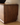 Made-to-order LumberLux Japanese-style walnut TV console with rattan door, showcasing sleek wood finish and woven rattan accents.