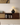 Made to order LumberLux Japanese style walnut TV console with rattan door, showcasing sleek wood finish and woven rattan accents.
