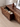 Solid Made sculpted walnut wood TV console cabinet with a sleek, handcrafted design, perfect for modern home entertainment setups.