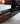 Made to order Low Loft modern walnut platform bed with integrated floating nightstands, showcasing sleek design and natural wood finish.