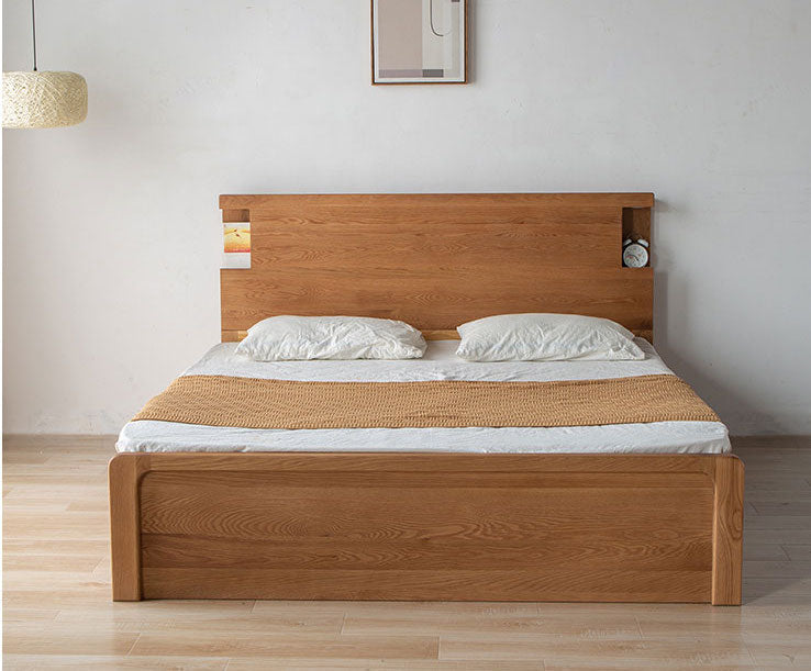 hydraulesch Bett mat Lagerraum aus Eichenholz gemaach