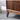 Made to order Black Forest midcentury freestanding wine and liquor bar in solid American walnut wood.