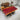 Sunrise live edge black Padauk wood table by Blink, showcasing the rich grain and natural edge of the Africa Padauk wooden slab.