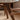 Made-to-order Walnut wood dining table from Circle of Life with a smooth, round surface and natural wood grain finish.