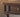 Made-to-order Citrine black walnut wood desk with turned legs, featuring a smooth surface and elegant craftsmanship.