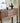 Made to order Black Walnut Wood Console Table by Elexa with sleek blinds design, showcasing smooth wood finish and modern style.