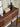 Made-to-order black walnut wood console table with sleek blinds design by Elexa, featuring a modern, minimalist style.