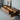 Made to order Fable walnut wood TV stand with mountain design, showcasing a sleek, natural finish and modern craftsmanship.
