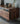 Made to order Fable Walnut Wood Mountain Design TV stand with sleek natural finish and modern mountain-inspired silhouette.