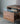 Solid walnut wood mountain design TV stand by Fable, made to order with natural wood grain and sleek, modern style.