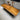 Luminous live edge hardwood Monkey Pod dining table with South African walnut, showcasing its natural wood grain and custom slab design.