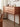 Made to order Oasis Antique console table with four drawers in solid cherry wood, featuring a classic and elegant design.