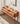 Made to order Oasis Antique console table by Laundra with four drawers, crafted from solid cherry wood, featuring elegant antique design.