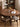 Earthy Four Leg Black Walnut Wood Round Table