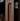 Solid walnut wood wine bar cabinet by Momentum with multiple wood finish options, featuring storage for wine bottles and glasses.