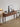 Made-to-order Cypress Walnut Wood Console Table by Pourx, showcasing a sleek, solid wood entryway design with smooth finish.