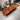 Solid American Walnut and Monkey Pod live edge dining table by Solvian, showcasing natural wood grain and handcrafted craftsmanship.