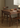 Made-to-order Synthesis American Style Solid Walnut Wood Dining Table showing a sleek, natural wood finish and sturdy design.
