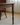 Made to order Synthesis American Style solid walnut wood dining table with sleek, natural wood finish and sturdy rectangular design.