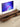Made-to-order Tapestry black walnut wood TV stand with track board for projector, showcasing a sleek, modern design.