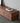 Made to order black walnut wood TV stand with hidden compartments from Wood FAS, showcasing sleek, modern design and natural wood grain.
