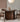 Made to order Wood Knot contemporary round table with three curved solid walnut wood legs and a smooth wooden tabletop.