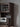 Harmonia multi-functional walnut wood tall kitchen cupboard with dark South American walnut hardwood finish and six wood options.
